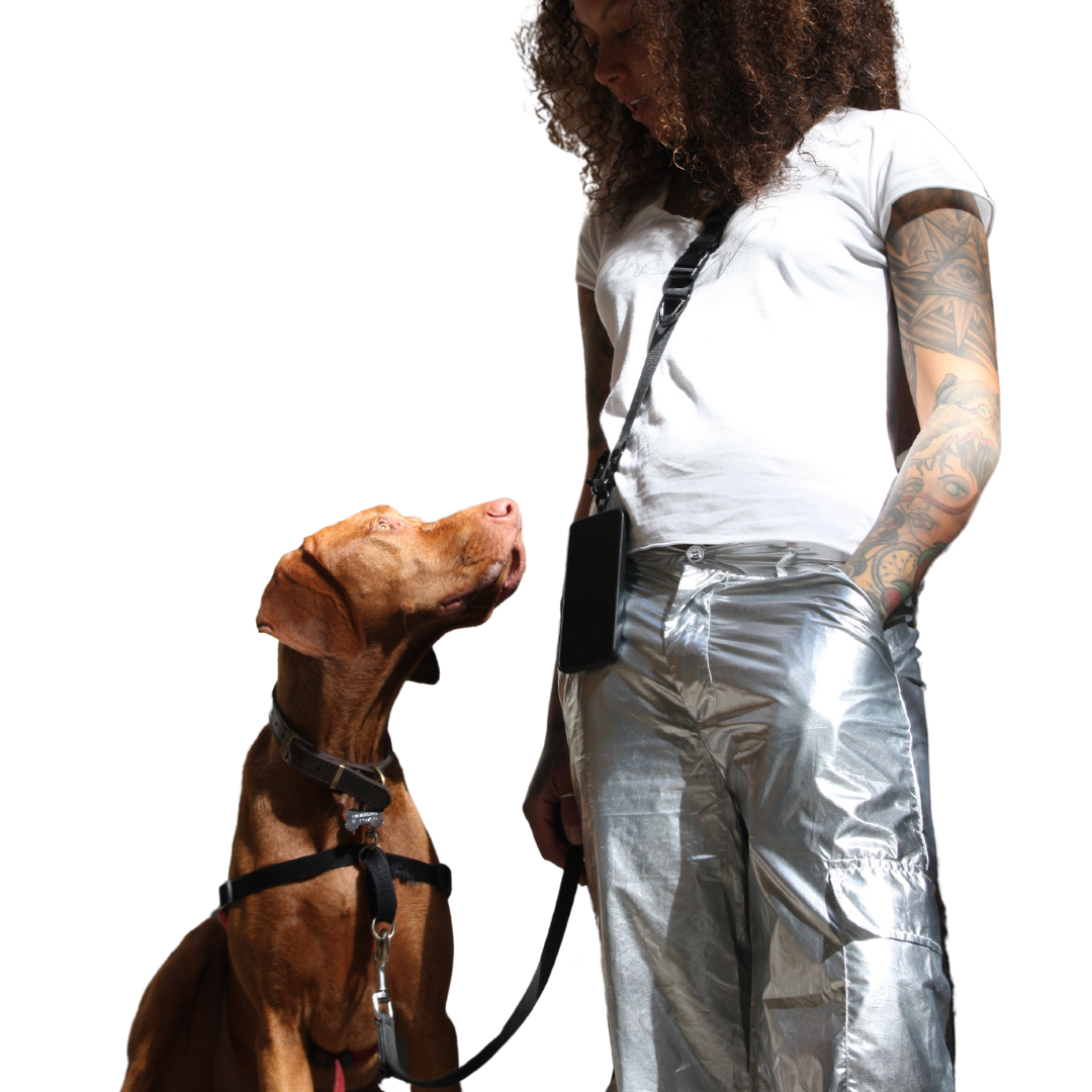 Girl poses with dog. Wearing 2-in-1 Utility Lanyard Crossbody phone strap black.